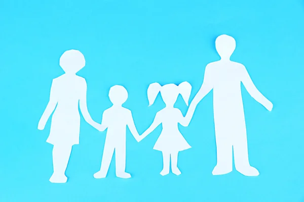 Family from paper on bright background — Stock Photo, Image
