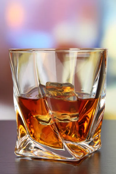Glass of whiskey, on bright background — Stock Photo, Image
