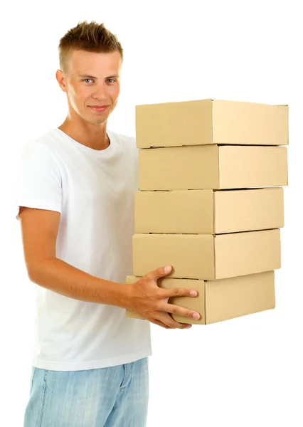 Jovem homem de entrega segurando parcelas, isolado em branco — Fotografia de Stock