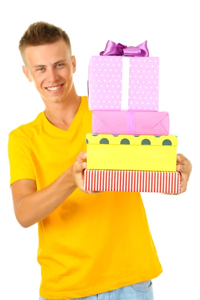Young man holding gifts, isolated on white — Stock Photo, Image