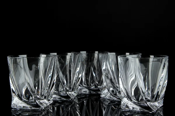 Empty glasses, isolated on black — Stock Photo, Image