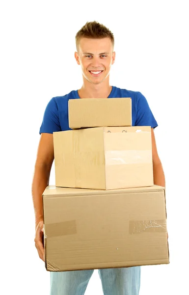 Jovem homem de entrega segurando parcelas, isolado em branco — Fotografia de Stock