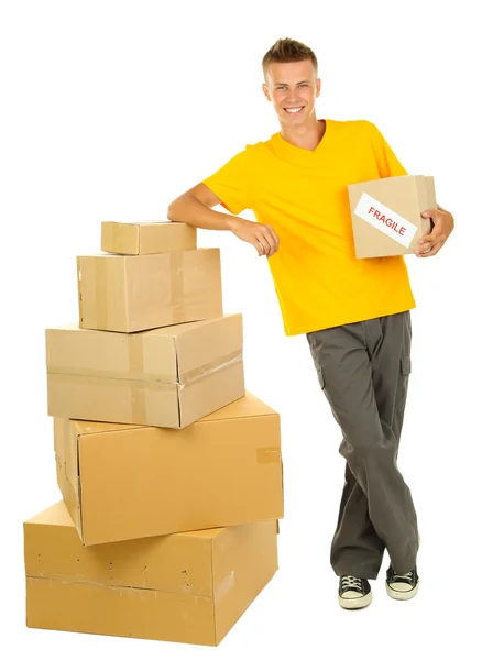 Young delivery man with parcels, isolated on white — Stock Photo, Image