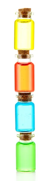 Μπουκάλια με χρωματιστά υγρά που απομονώνονται σε λευκό — Φωτογραφία Αρχείου