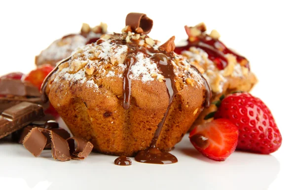 Tasty muffin cakes with strawberries and chocolate, isolated on white — Stock Photo, Image