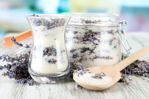 Jar of lavender sugar and fresh lavender flowers on bright background — Stock Photo, Image