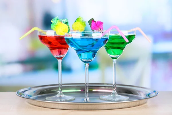 Different cocktails on bright background — Stock Photo, Image