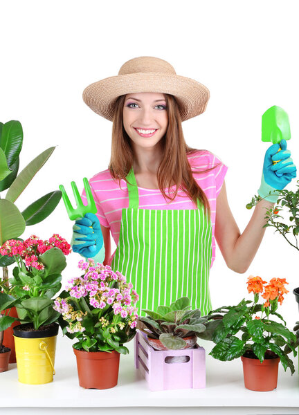 Beautiful girl gardener with flowers isolated on white