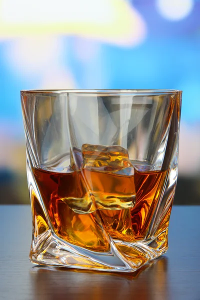 Glass of whiskey, on bright background — Stock Photo, Image