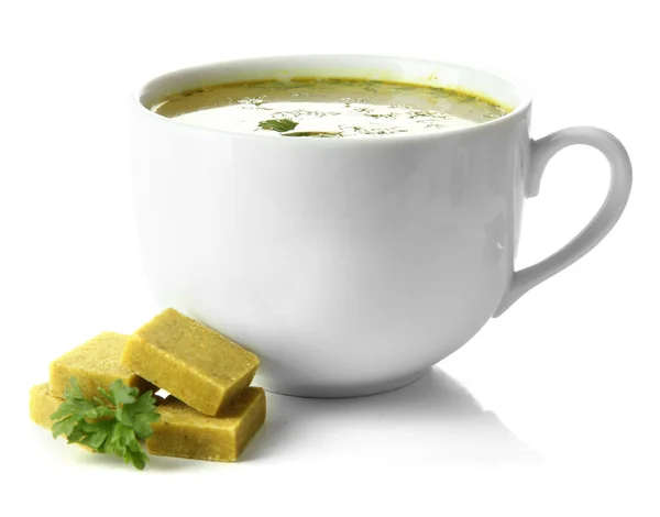 Cup of soup with bouillon cubes, isolated on white — Stock Photo, Image