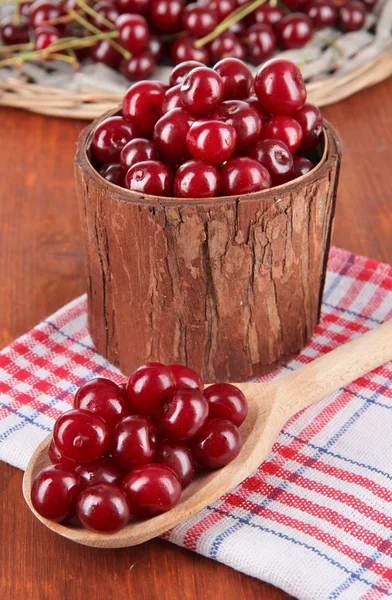 Sweet cherry in wooden basket on table close-up