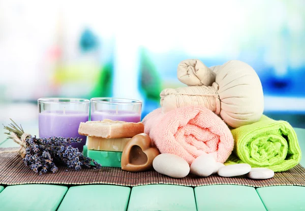 Still life with lavender candle, soap, massage balls, soap and fresh lavender, on bright background — Stock Photo, Image