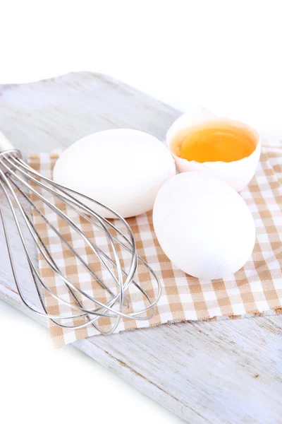 Corolla and eggs on wooden board isolated on white — Stock Photo, Image