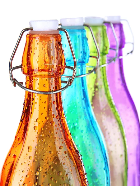 Colorful bottles isolated on white — Stock Photo, Image