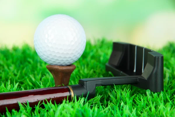 Golf ball and driver on green grass outdoor close up — Stok Foto