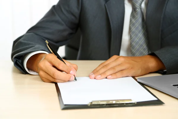 Closeup of businessman hands with clipboard — Stock Photo, Image