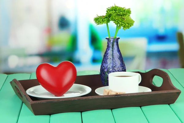 Wooden tray with breakfast, on bright background — Stock Photo, Image