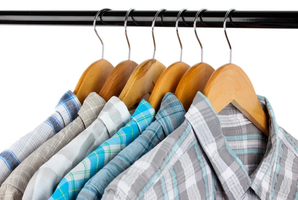 Shirts with ties on wooden hangers isolated on white — Stock Photo, Image