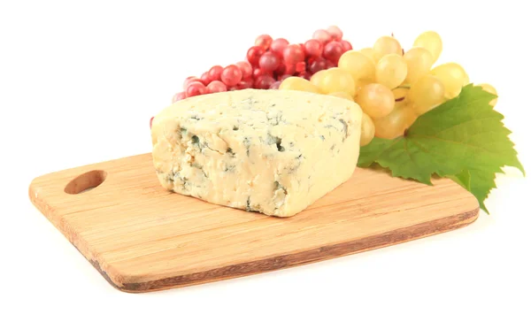 Tasty blue cheese and grape on cutting board, isolated on white — Stock Photo, Image