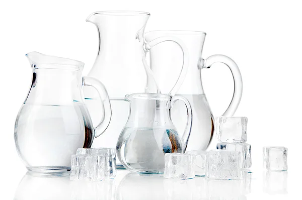 Glass pitchers of water isolated on white — Stock Photo, Image