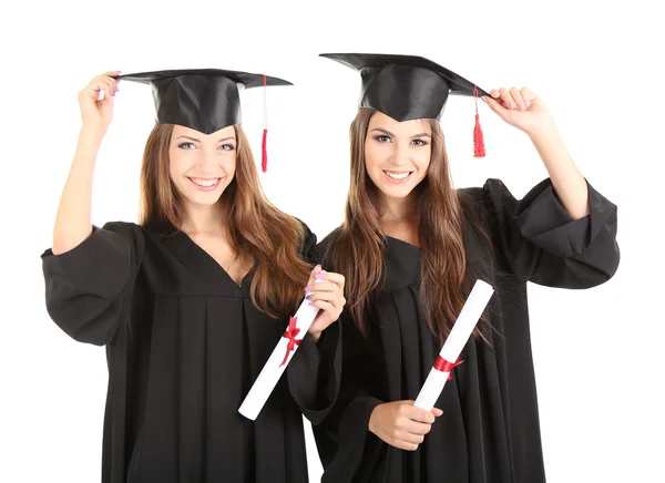 Due felici studenti laureati isolati su bianco — Foto Stock