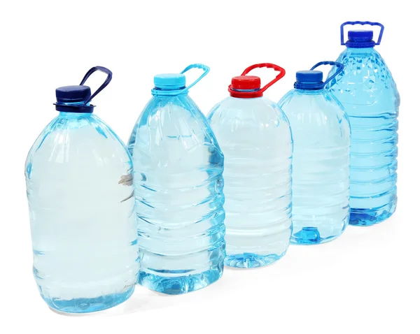 Agua en grandes botellas aisladas en blanco — Foto de Stock