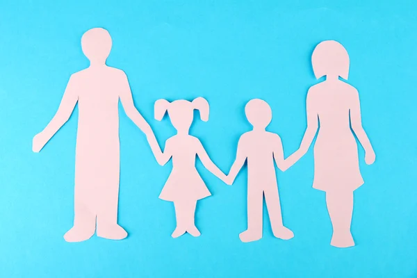 Family from paper on bright background — Stock Photo, Image