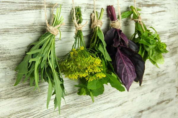 Fresh herbs on wooden background