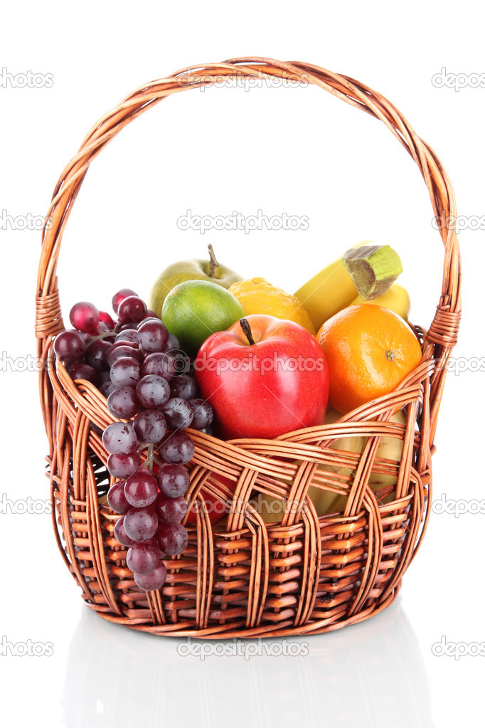 Different fruits in wicker basket isolated on white