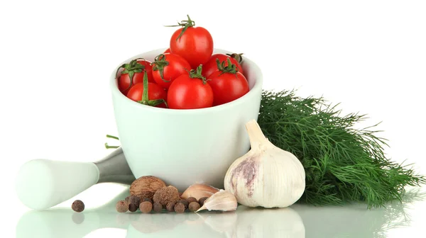 Composition of mortar, spices, tomatoes and green herbs, isolated on white — Stock Photo, Image