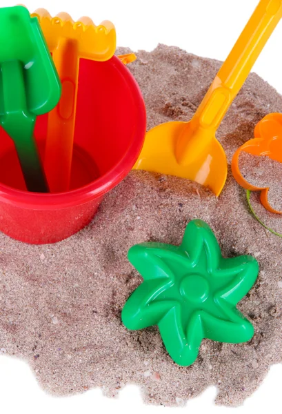 Kinderspielzeug auf Sand isoliert auf weiß — Stockfoto