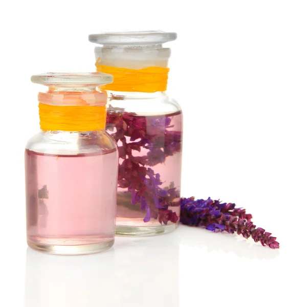Medicine bottles with salvia flowers, isolated on white — Stock Photo, Image
