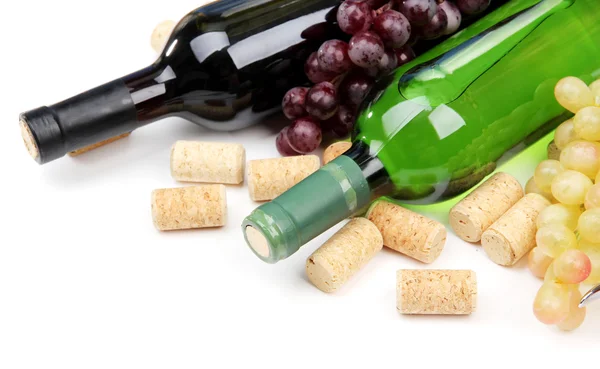Bottles of wine, grapes and corks, isolated on white — Stock Photo, Image