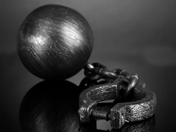 Ball and chain on grey background — Stock Photo, Image