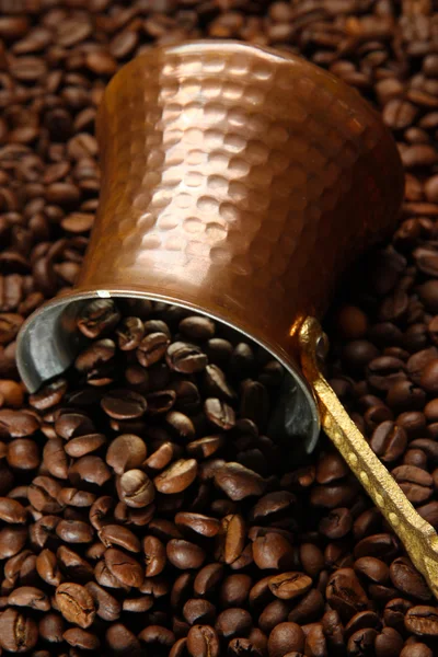 Metal turk on coffee beans background — Stock Photo, Image