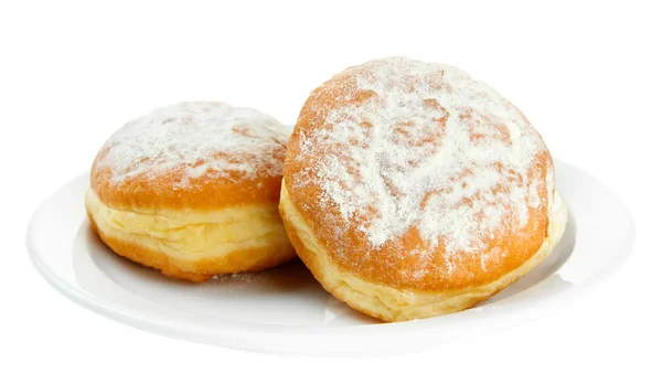 Вкусные пончики на тарелке, изолированные на белом — стоковое фото