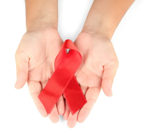 AIDS ribbon in hands isolated on white — Stock Photo, Image