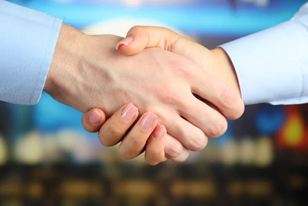 Business handshake on bright background — Stock Photo, Image