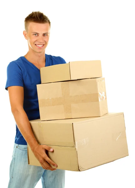 Jovem homem de entrega segurando parcelas, isolado em branco — Fotografia de Stock