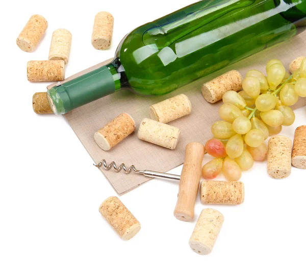 Bottle of wine, grapes and corks, isolated on white — Stock Photo, Image