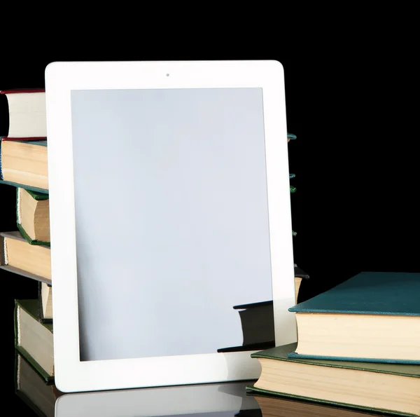 Tablet and books on bright background — Stock Photo, Image