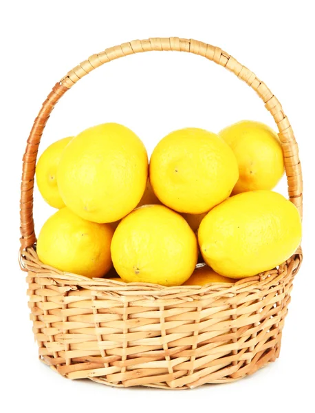 Ripe lemons in wicker basket isolated on white — Stock Photo, Image