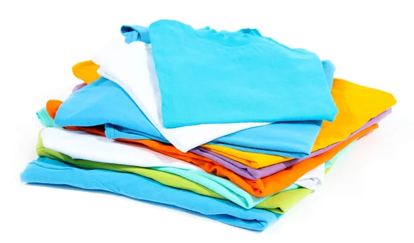 Neatly folded shirts isolated on white — Stock Photo, Image