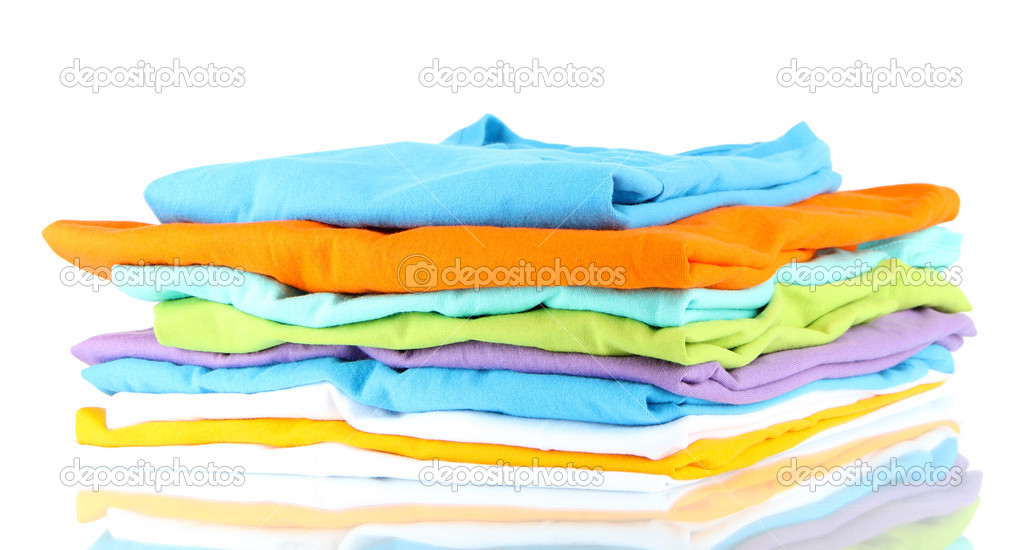 Neatly folded shirts isolated on white