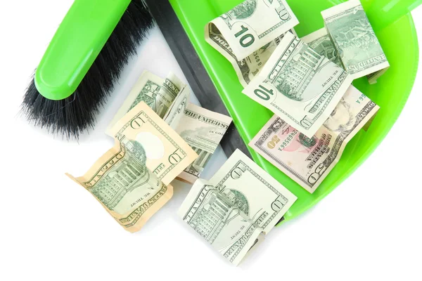 Varre o dinheiro na pá no fundo branco close-up — Fotografia de Stock