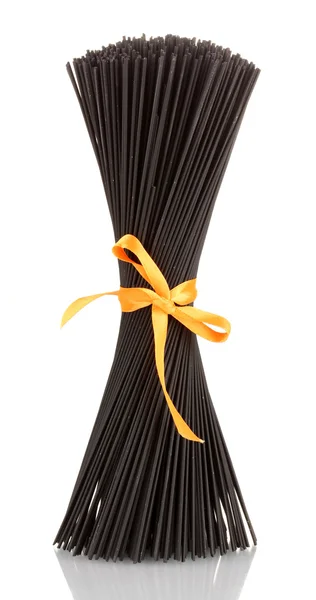 Black spaghetti with ribbon isolated on white — Stock Photo, Image