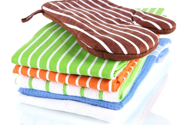 Brown potholder and stack of kitchen towels isolated on white — Stock Photo, Image