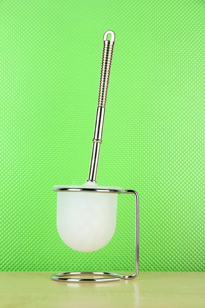 Toilet brush on green background — Stock Photo, Image