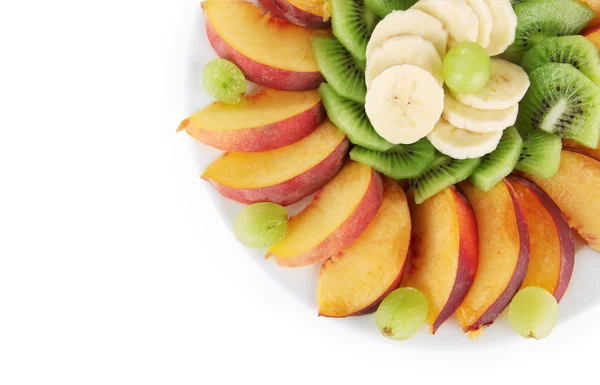 Assortment of sliced fruits on plate, isolated on white — Stock Photo, Image