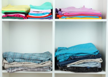 Clothes neatly folded on shelves